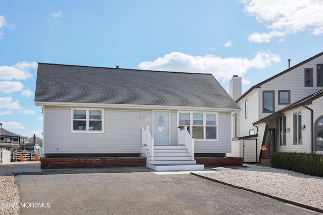 view of front of property with a shingled roof