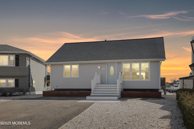 view of front of house featuring roof with shingles