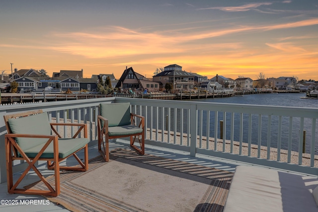 exterior space featuring a water view and a residential view