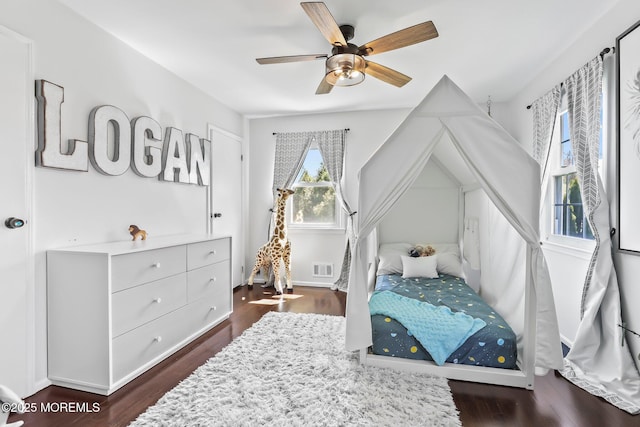 bedroom featuring dark wood-type flooring and ceiling fan