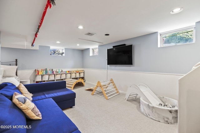 carpeted living room featuring a healthy amount of sunlight