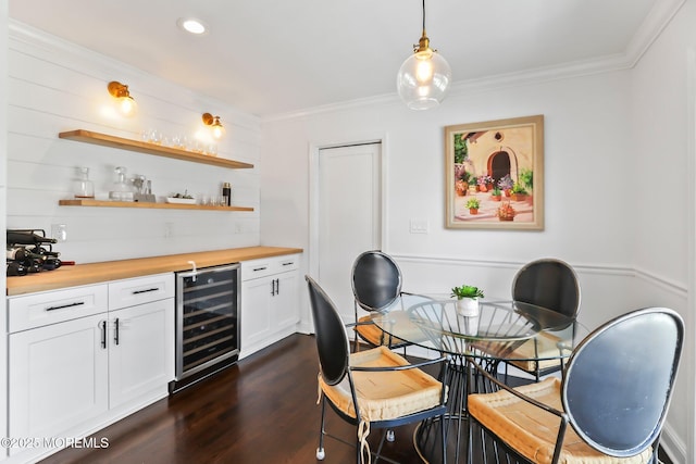 interior space featuring white cabinets, wood counters, pendant lighting, dark hardwood / wood-style flooring, and wine cooler