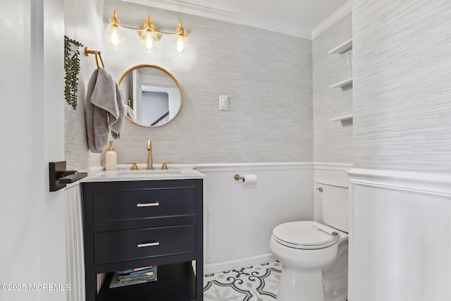 bathroom with toilet, vanity, tile patterned flooring, and crown molding