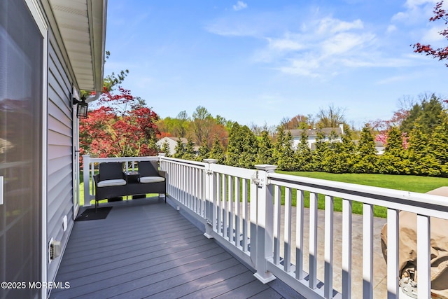 wooden deck with a yard