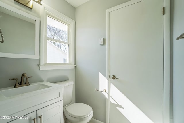 bathroom with toilet and vanity