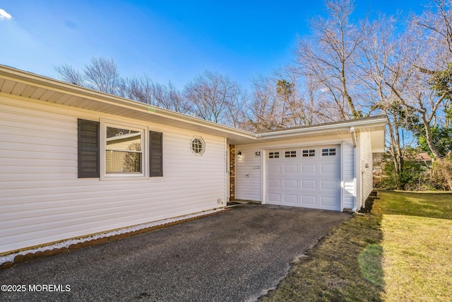 garage with aphalt driveway