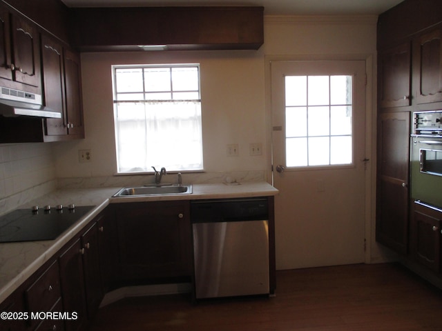 kitchen with sink, black electric stovetop, wall oven, stainless steel dishwasher, and dark brown cabinets