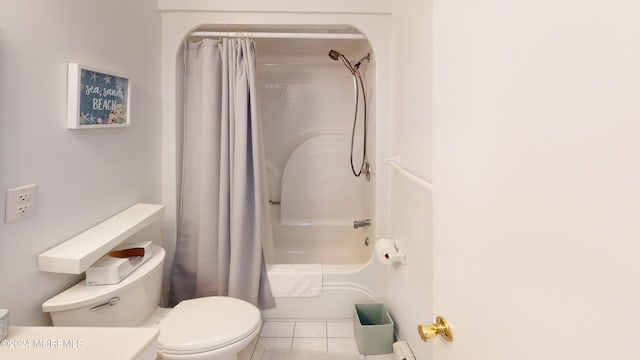 bathroom with tile patterned floors, toilet, and shower / bath combo