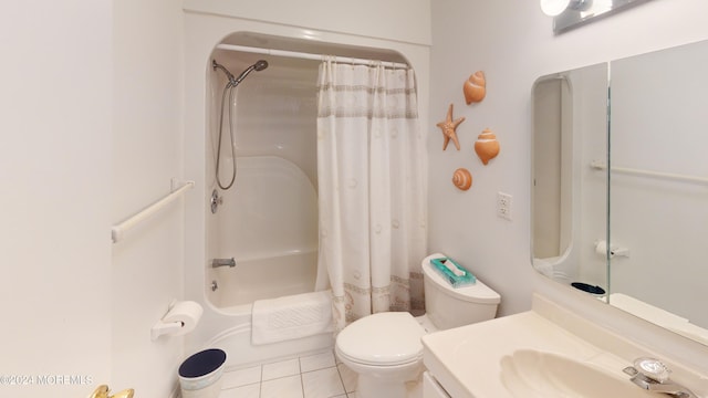 full bathroom featuring shower / tub combo with curtain, vanity, tile patterned flooring, and toilet