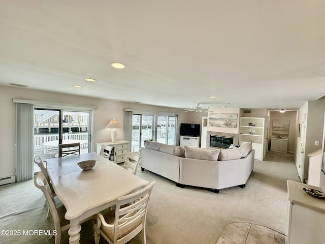 living room with light carpet and ceiling fan