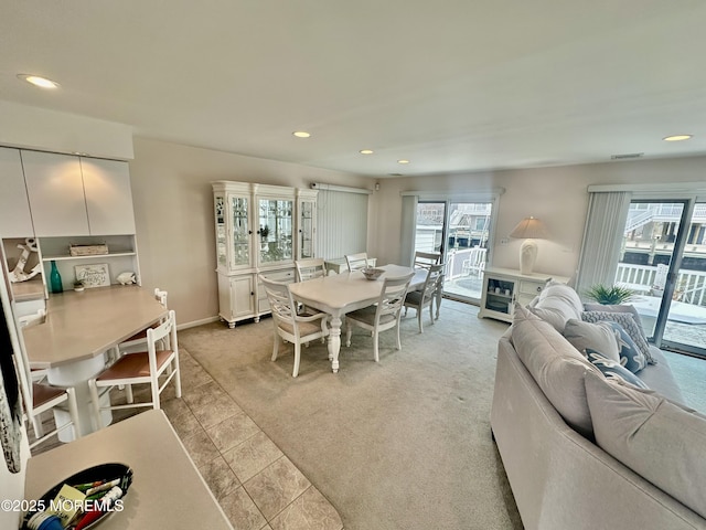 dining space with light carpet