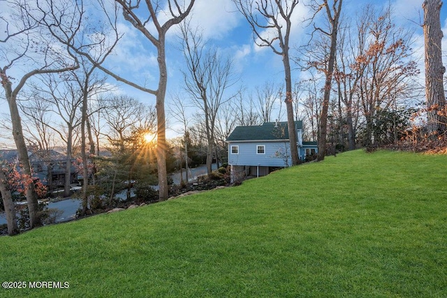 view of yard at dusk