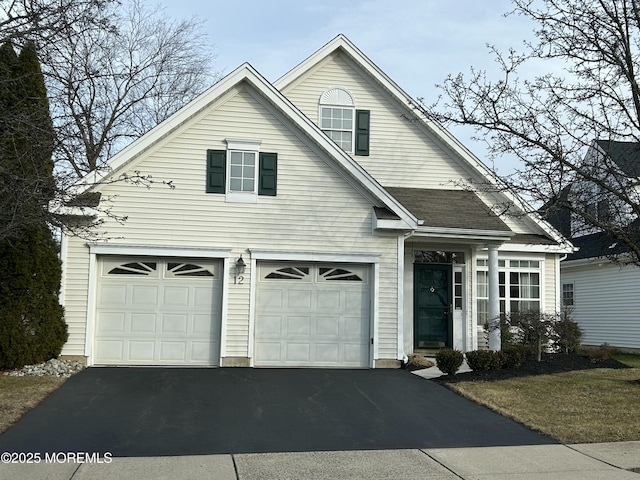 view of front of home with a garage and driveway