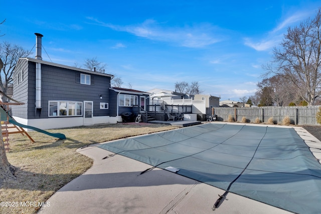 view of pool with a lawn, fence, and a fenced in pool