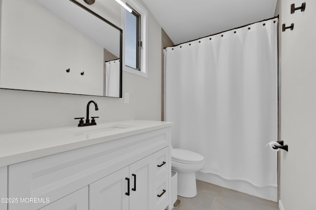 bathroom with vanity, toilet, and tile patterned floors