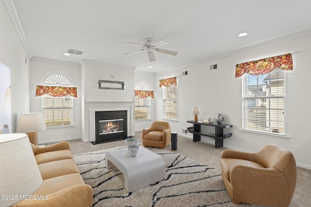 living room featuring light carpet, ornamental molding, a fireplace with flush hearth, and visible vents