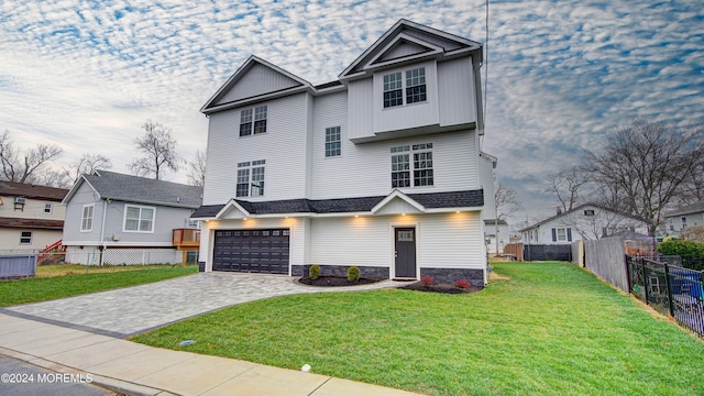 view of front of house with a garage and a front yard