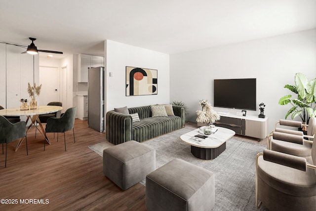 living room with ceiling fan and dark hardwood / wood-style flooring