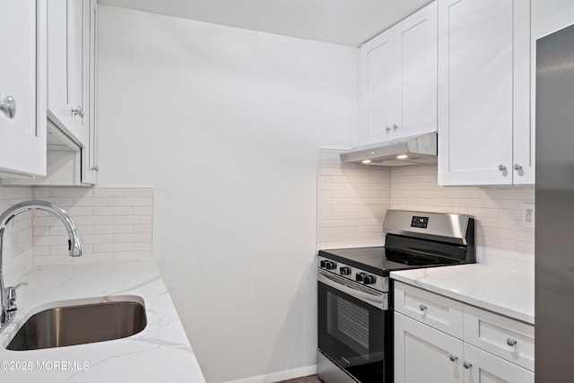 kitchen featuring sink, light stone countertops, white cabinetry, and stainless steel appliances