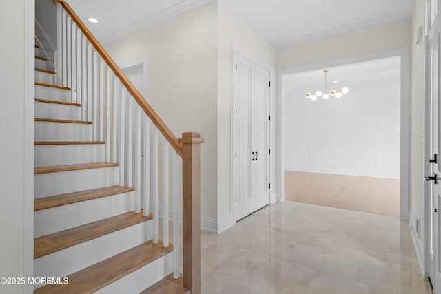 foyer featuring ornamental molding