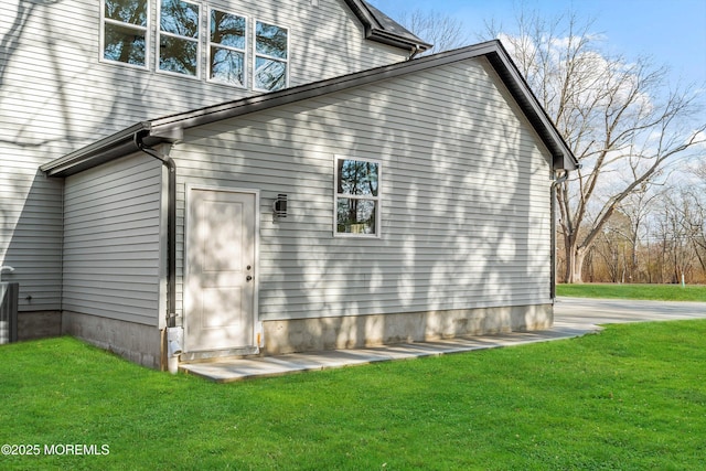 rear view of house with a lawn