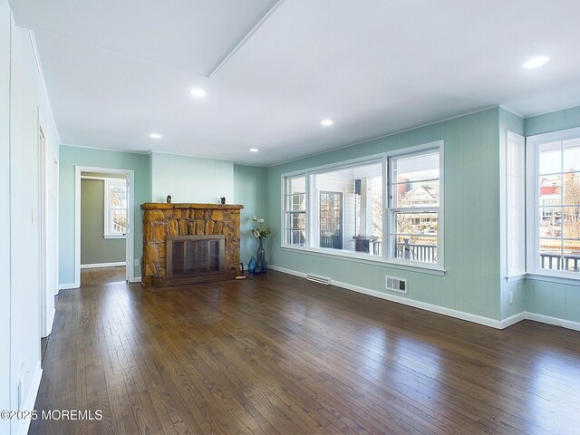 78 Lake Ave, Ocean Grove, NJ 07756 - unfurnished living room featuring a stone fireplace, wood-type flooring, visible vents, and recessed lighting