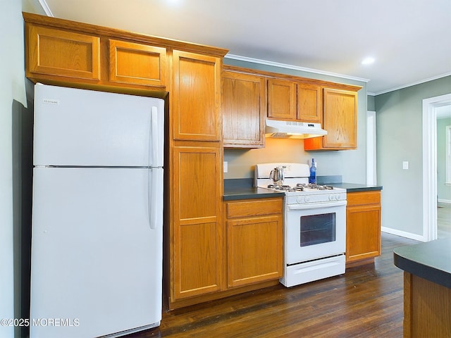 78 Lake Ave, Ocean Grove, NJ 07756 - kitchen with brown cabinets, dark countertops, ornamental molding, white appliances, and under cabinet range hood