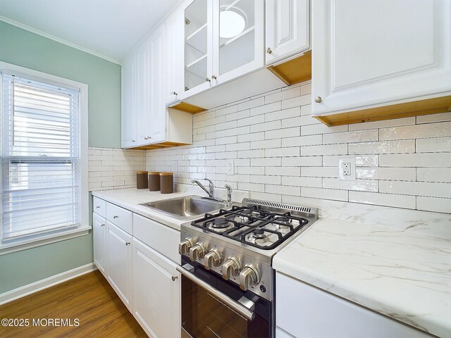 78 Lake Ave, Ocean Grove, NJ 07756 - kitchen featuring a sink, white cabinets, gas range, tasteful backsplash, and glass insert cabinets