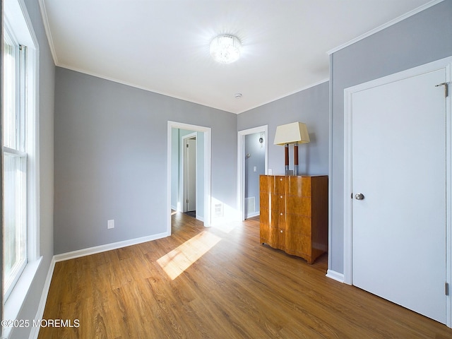 78 Lake Ave, Ocean Grove, NJ 07756 - unfurnished bedroom featuring visible vents, crown molding, baseboards, and wood finished floors