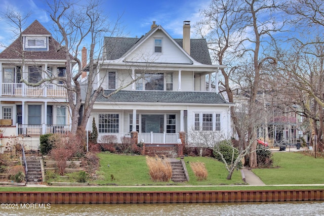 78 Lake Ave, Ocean Grove, NJ 07756 - view of front of property with a shingled roof, a chimney, stairway, a water view, and a front lawn