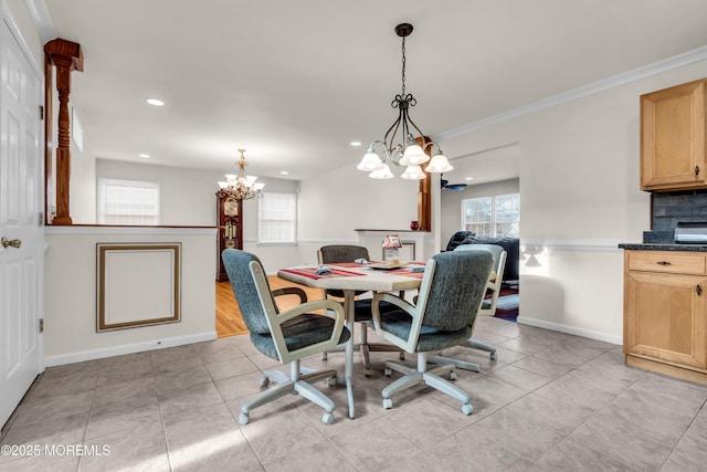 tiled dining space featuring ornamental molding