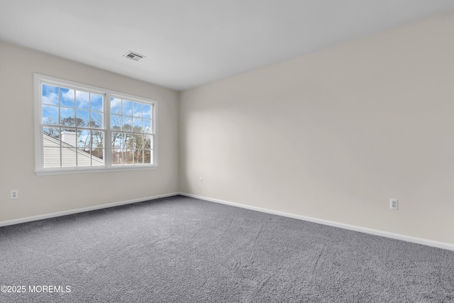 unfurnished room featuring carpet