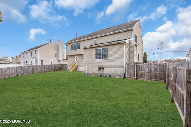 back of property featuring a lawn