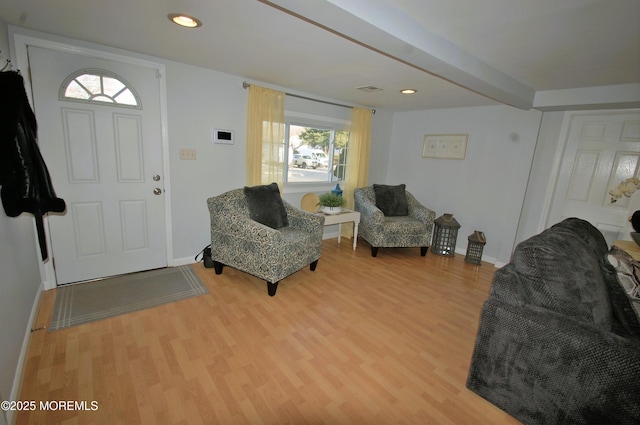 entryway featuring baseboards, beam ceiling, recessed lighting, and wood finished floors