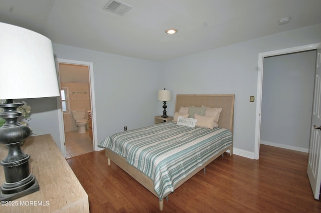 bedroom with baseboards, connected bathroom, recessed lighting, visible vents, and dark wood-type flooring