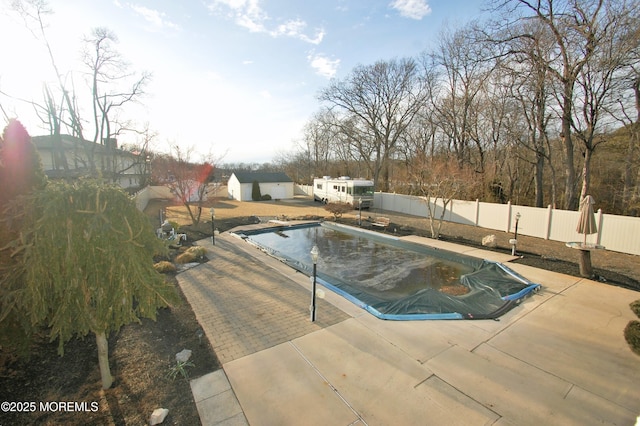 view of pool featuring a patio, a fenced backyard, and a fenced in pool