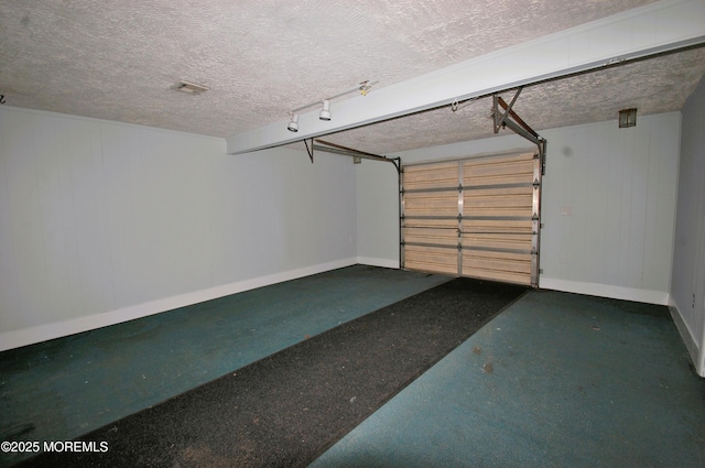 garage featuring baseboards