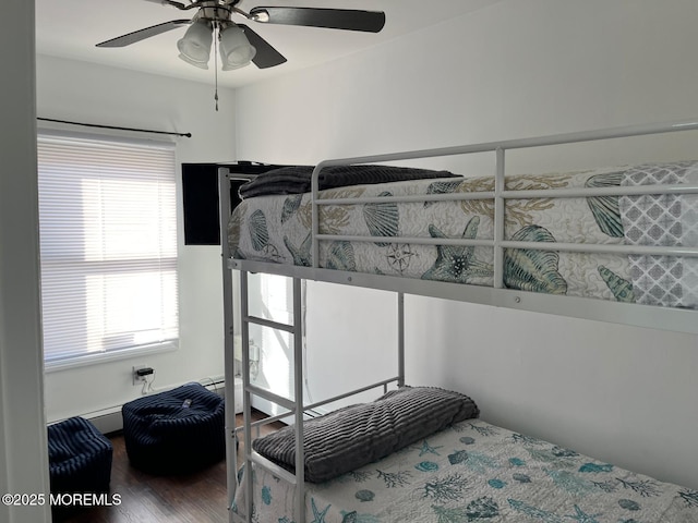 bedroom featuring ceiling fan and wood-type flooring