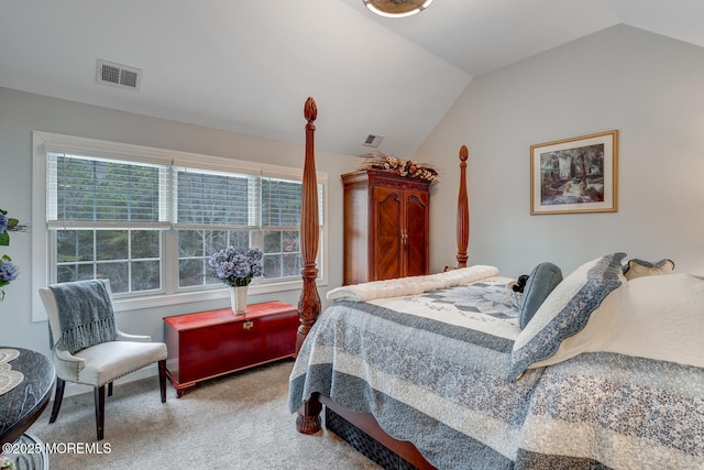 carpeted bedroom with lofted ceiling