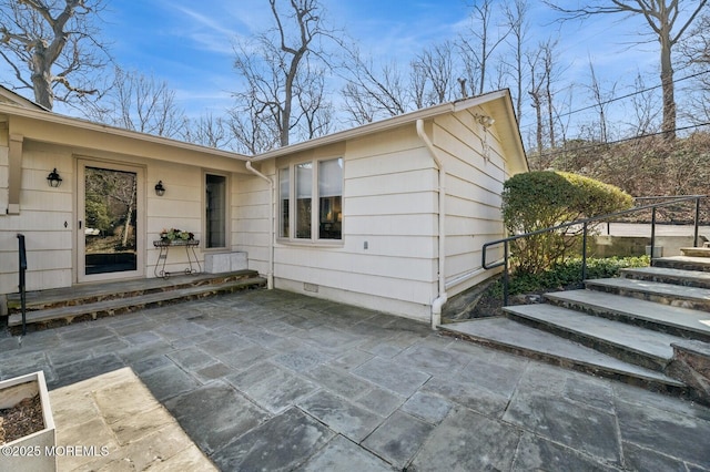 exterior space featuring crawl space and a patio area