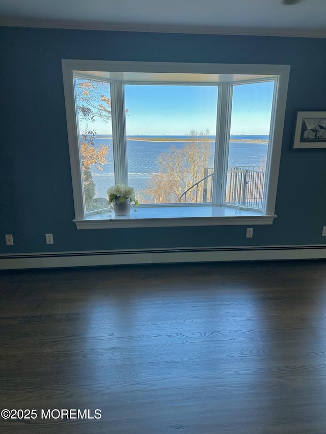 unfurnished room featuring dark wood-type flooring, a water view, crown molding, and baseboards