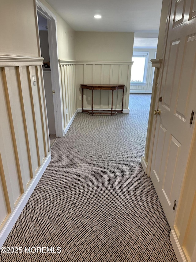 hallway featuring wainscoting, carpet flooring, and recessed lighting