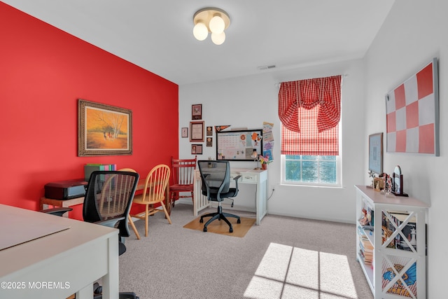 office area with visible vents and light carpet