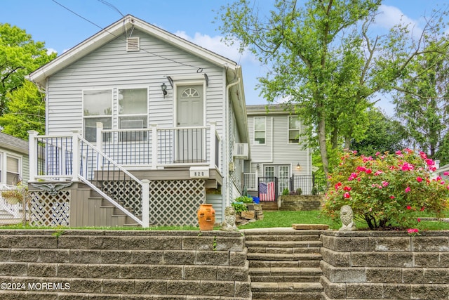 shotgun-style home with stairway