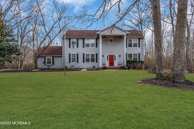 greek revival inspired property with a front lawn