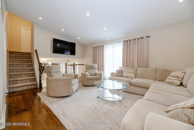 living room featuring dark wood-style floors, stairs, recessed lighting, and lofted ceiling