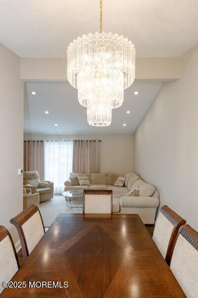 dining area featuring an inviting chandelier and recessed lighting