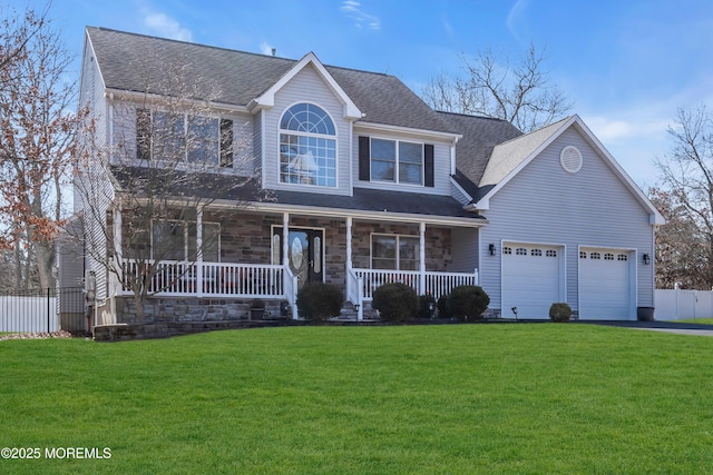 view of front of house featuring an attached garage, covered porch, fence, stone siding, and a front lawn