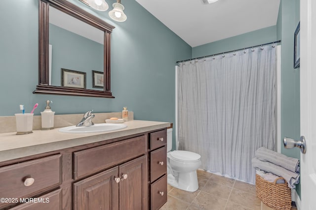 bathroom featuring a shower with curtain, vanity, toilet, and tile patterned floors