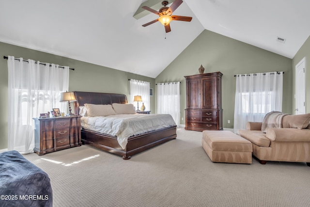 bedroom featuring baseboards, visible vents, a ceiling fan, light colored carpet, and high vaulted ceiling